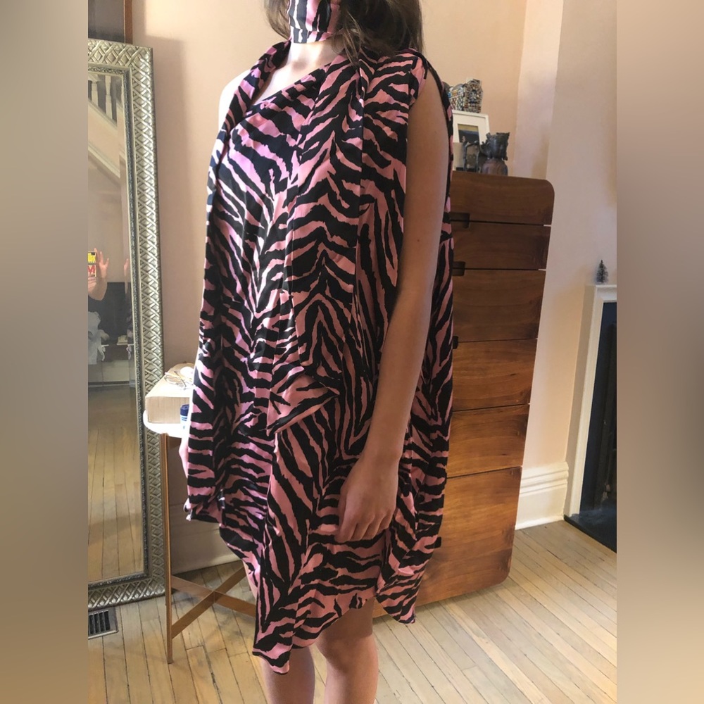 Very festive asymmetrical long-blouse/ mini dress.never worn